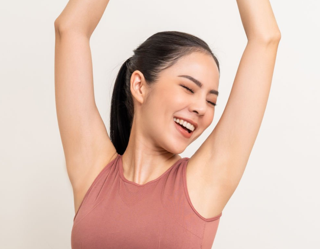 Woman stretching with her arms raised and smiling, the banner for NSJ's liver protection range